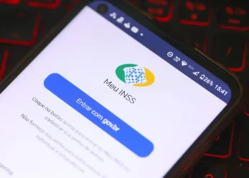 Fachada de uma agência da Previdência Social com logotipo do INSS.